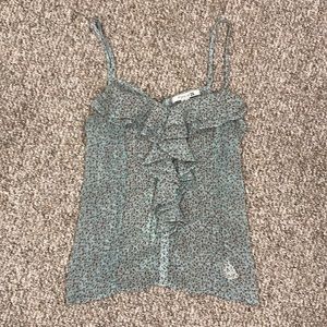 Tank top with ruffle on front and zipper on back